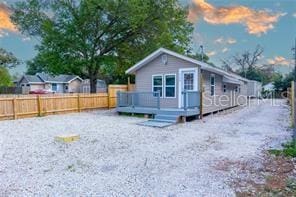 exterior space featuring a deck and fence