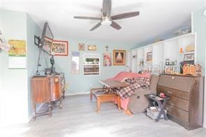 dining area with ceiling fan and wood finished floors