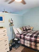 bedroom featuring wood finished floors