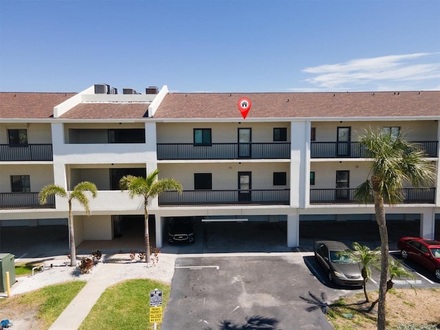 view of property featuring a parking lot