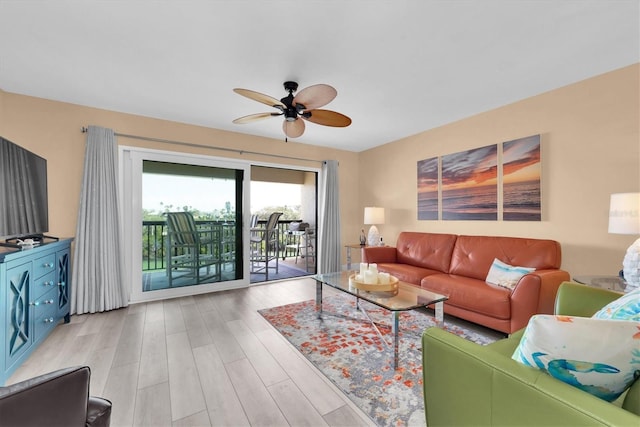 living area featuring ceiling fan and wood finished floors