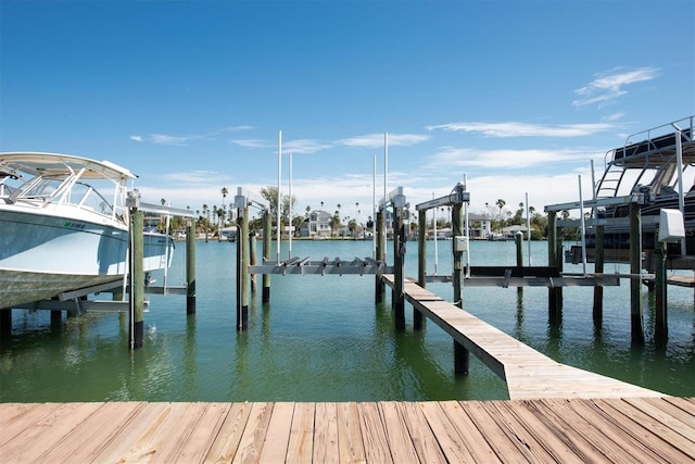 view of dock with a water view and boat lift