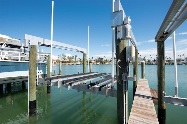 view of dock with a water view and boat lift