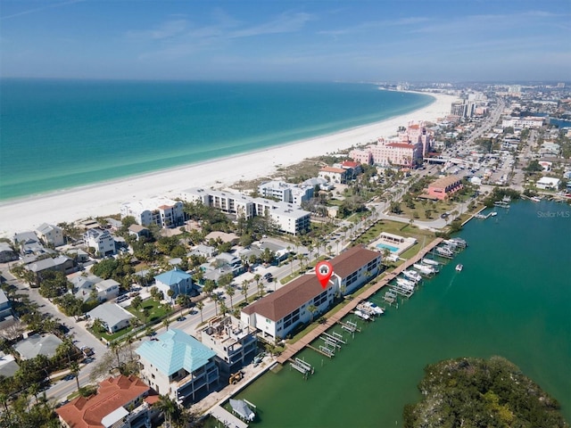 bird's eye view with a water view and a beach view