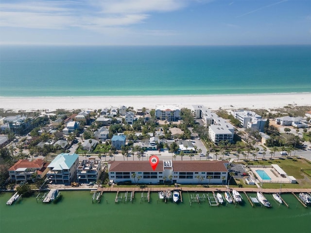 bird's eye view featuring a water view and a view of the beach