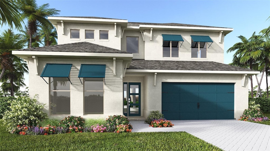 view of front of property with a garage, decorative driveway, and stucco siding