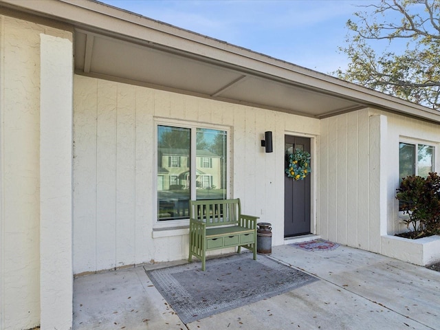 entrance to property with a patio