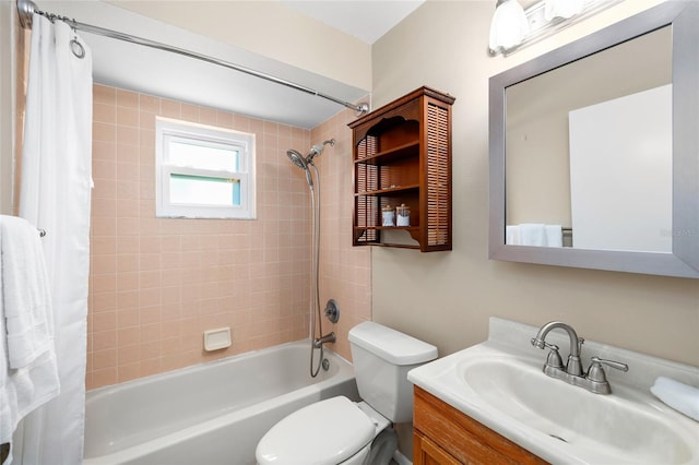 full bathroom featuring shower / bath combo, vanity, and toilet