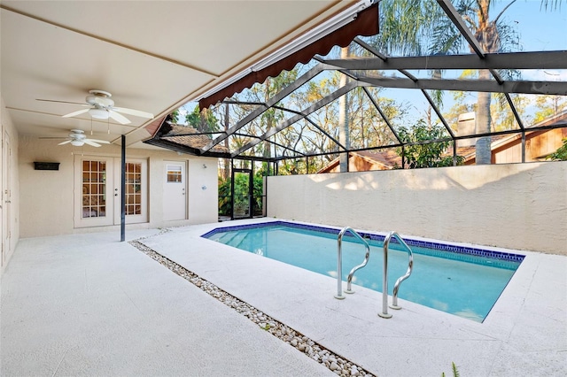 view of pool featuring a fenced in pool, a ceiling fan, a patio, glass enclosure, and french doors