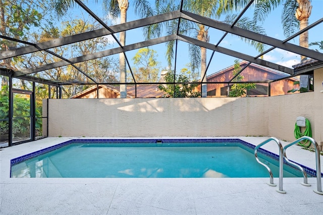 pool featuring a lanai and a patio