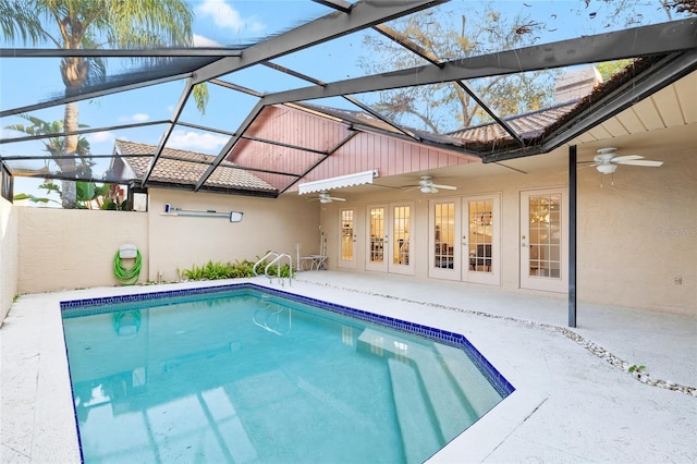 outdoor pool featuring a patio, french doors, a lanai, and a ceiling fan