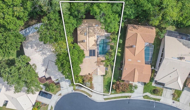 birds eye view of property with a residential view