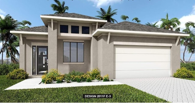 view of front facade featuring decorative driveway, an attached garage, and stucco siding