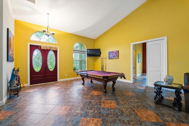 recreation room featuring baseboards, pool table, french doors, high vaulted ceiling, and a notable chandelier