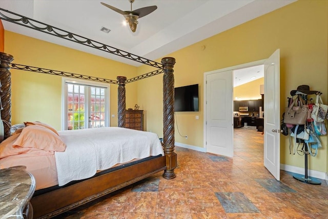 bedroom featuring stone finish floor, baseboards, visible vents, and ceiling fan