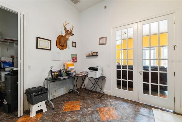 entryway featuring french doors, visible vents, stone finish floor, and baseboards