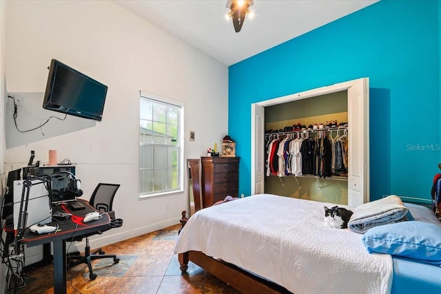 bedroom featuring a closet and baseboards