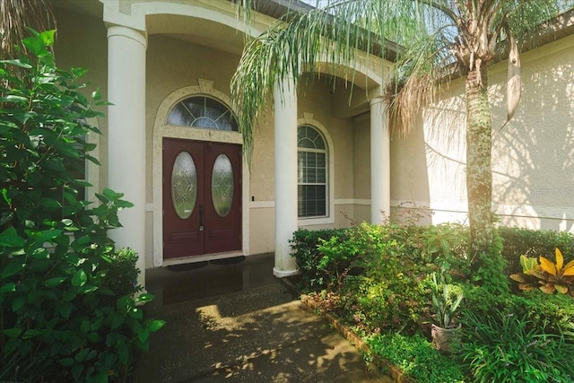 property entrance featuring stucco siding