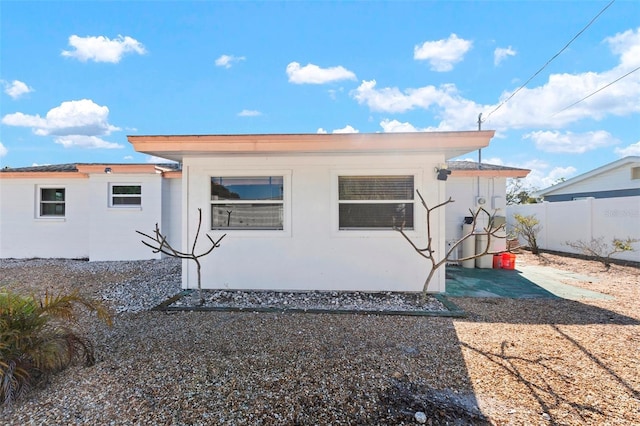 rear view of property with fence