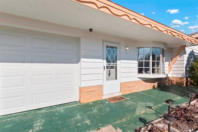 property entrance with an attached garage