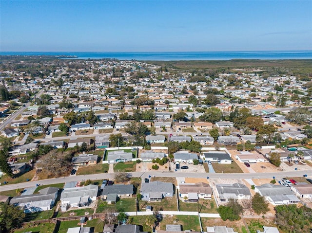 birds eye view of property featuring a water view and a residential view