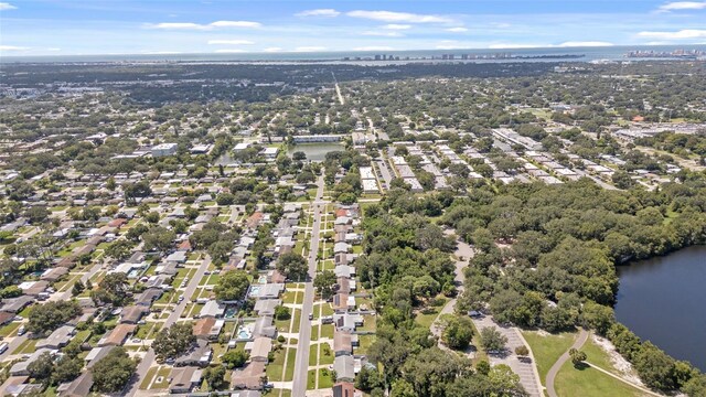 birds eye view of property featuring a water view and a residential view