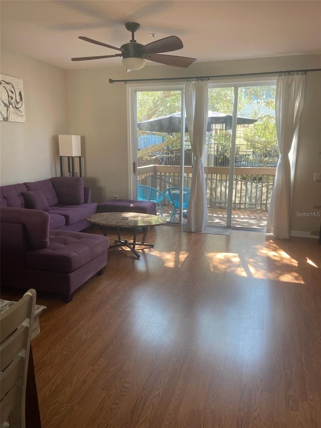 living area featuring ceiling fan and wood finished floors