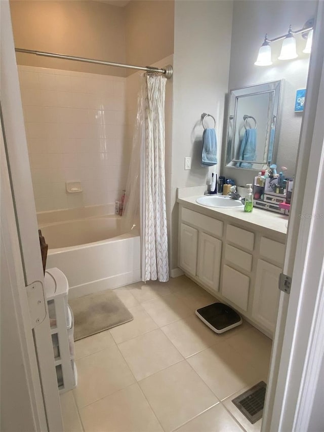 bathroom featuring tile patterned flooring, visible vents, vanity, and shower / bath combo with shower curtain