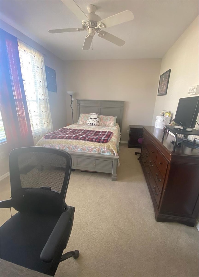 bedroom featuring ceiling fan and light colored carpet