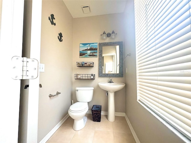 3128 Bayshore Oaks Dr, Tampa, FL 33611 - half bath with toilet and tile patterned flooring