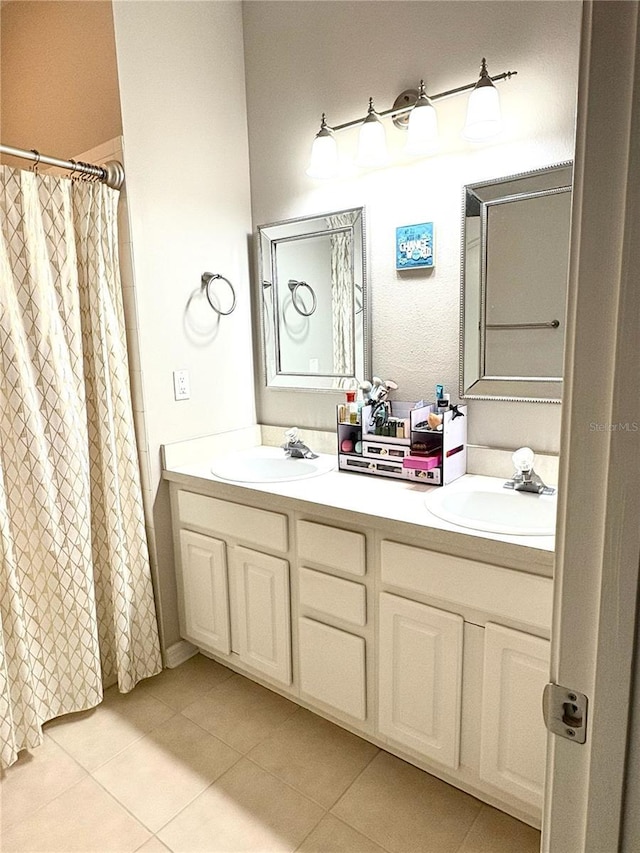 3128 Bayshore Oaks Dr, Tampa, FL 33611 - full bathroom featuring tile patterned flooring, double vanity, and a shower with curtain
