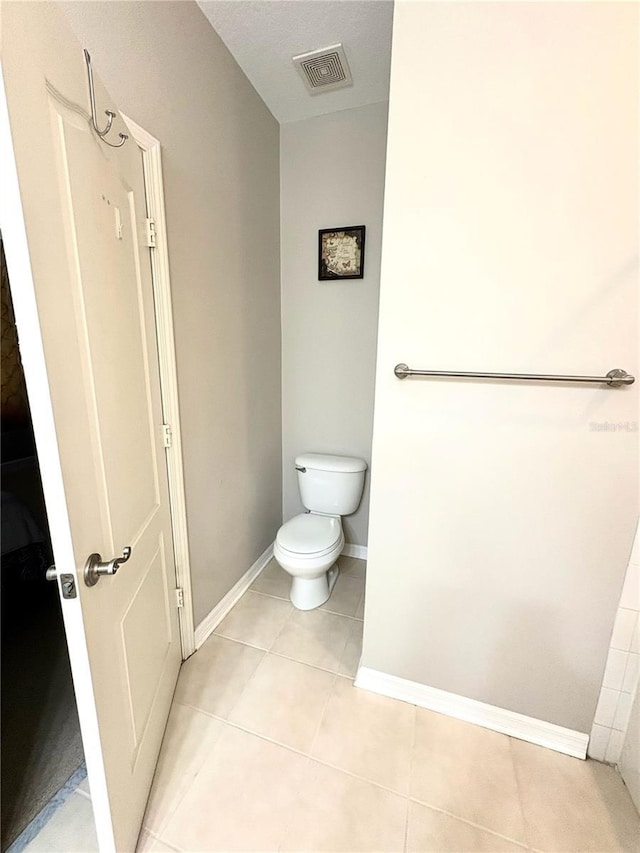 3128 Bayshore Oaks Dr, Tampa, FL 33611 - bathroom featuring toilet and tile patterned flooring