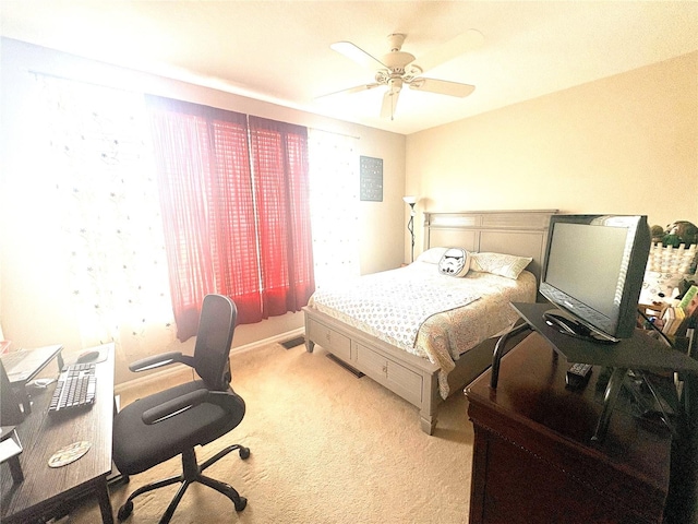 3128 Bayshore Oaks Dr, Tampa, FL 33611 - carpeted bedroom with an office area and ceiling fan