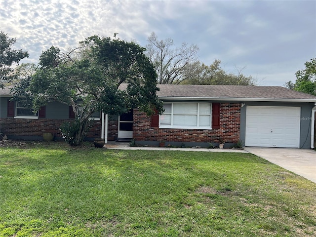 ranch-style home with driveway, a front lawn, an attached garage, and brick siding