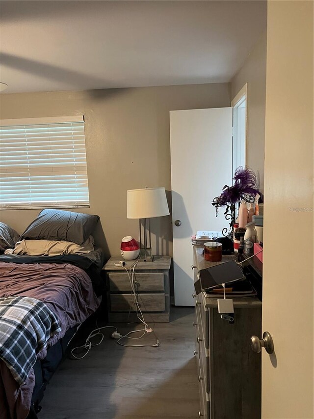 bedroom featuring wood finished floors