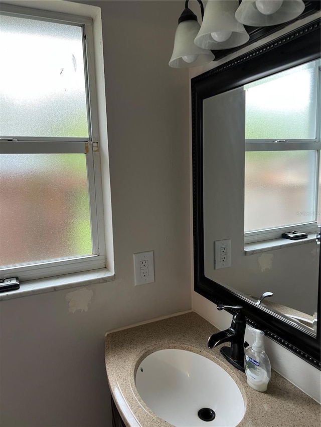 bathroom featuring a sink and a healthy amount of sunlight