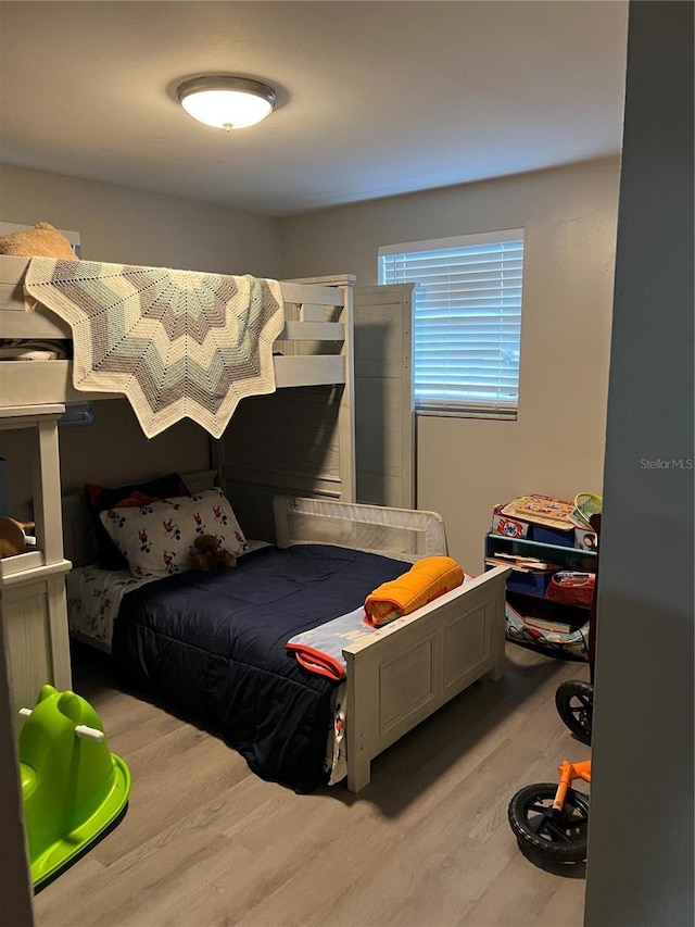 bedroom with light wood finished floors