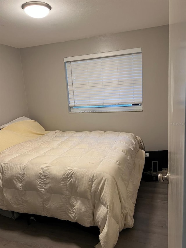 bedroom featuring wood finished floors