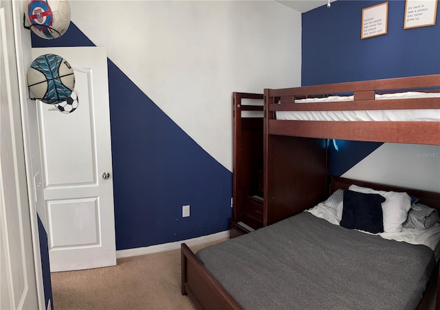 carpeted bedroom with baseboards