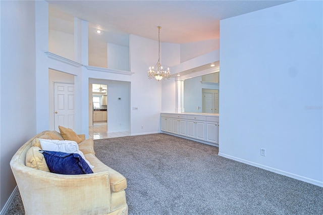 living area featuring baseboards, an inviting chandelier, carpet flooring, high vaulted ceiling, and recessed lighting