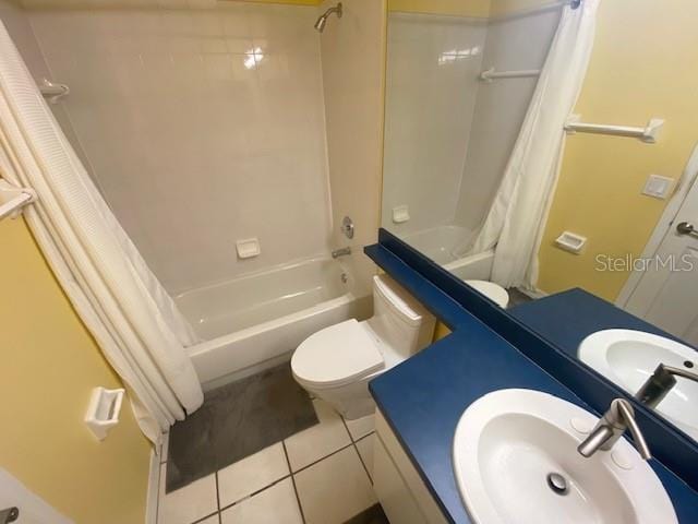 bathroom featuring toilet, shower / bathtub combination with curtain, tile patterned flooring, and vanity