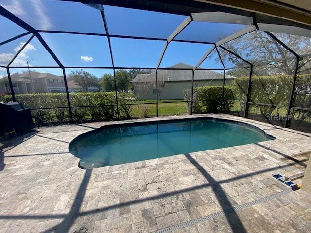 pool featuring a patio area and a lanai