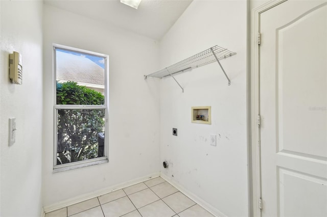 laundry room with light tile patterned flooring, hookup for a washing machine, laundry area, baseboards, and electric dryer hookup