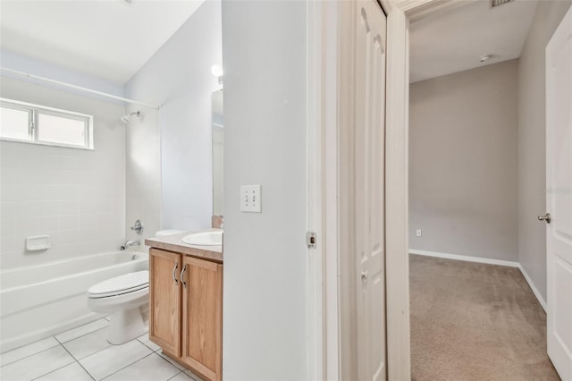 full bath with toilet, washtub / shower combination, vanity, baseboards, and tile patterned floors