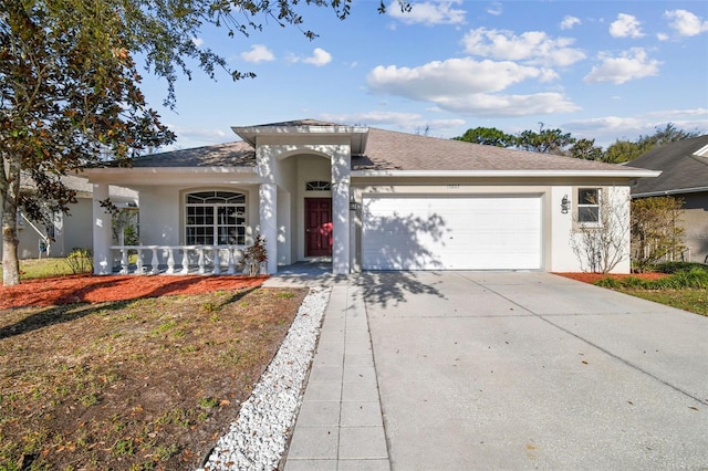 ranch-style house featuring roof with shingles, stucco siding, a porch, concrete driveway, and a garage