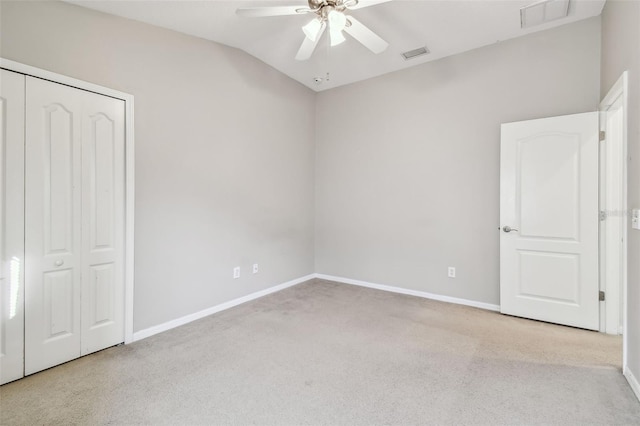 unfurnished bedroom with carpet floors, visible vents, and baseboards