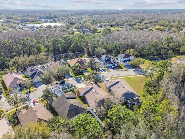 bird's eye view featuring a residential view and a view of trees