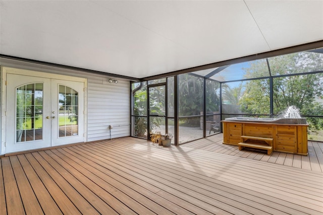 unfurnished sunroom with french doors