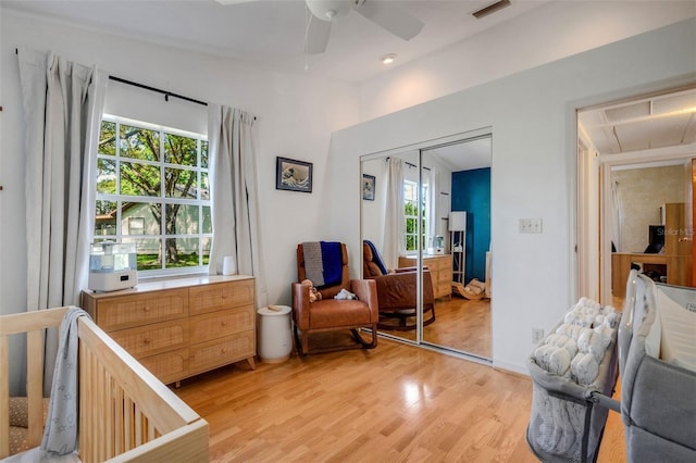 bedroom featuring ceiling fan, a closet, visible vents, and light wood-style floors