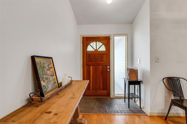 entryway featuring wood finished floors and baseboards